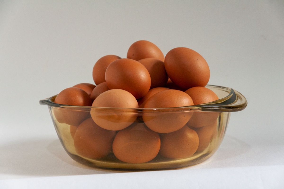 A bowl of fresh organic brown eggs on a kitchen counter