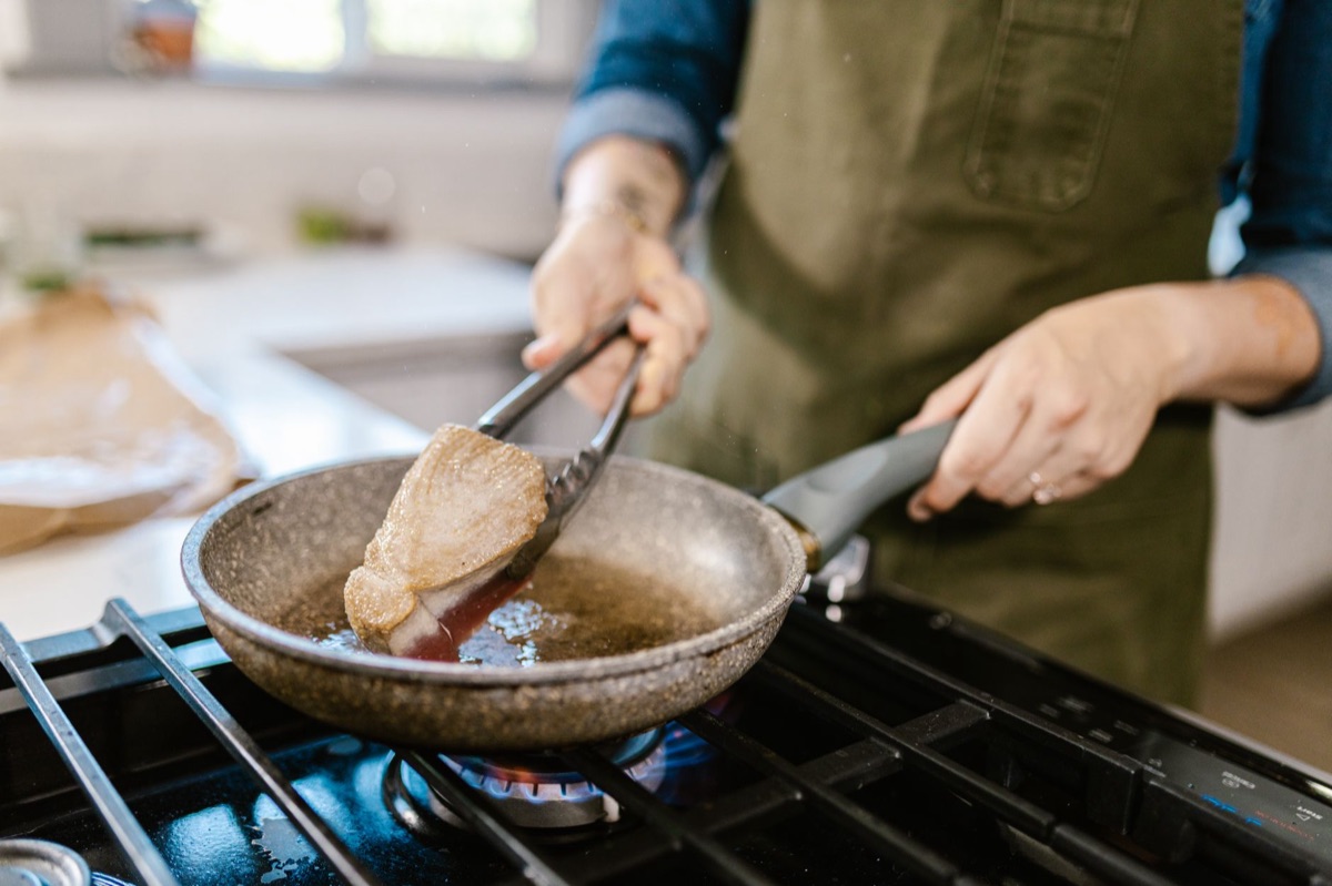 Steak searing in a hot cast iron skillet