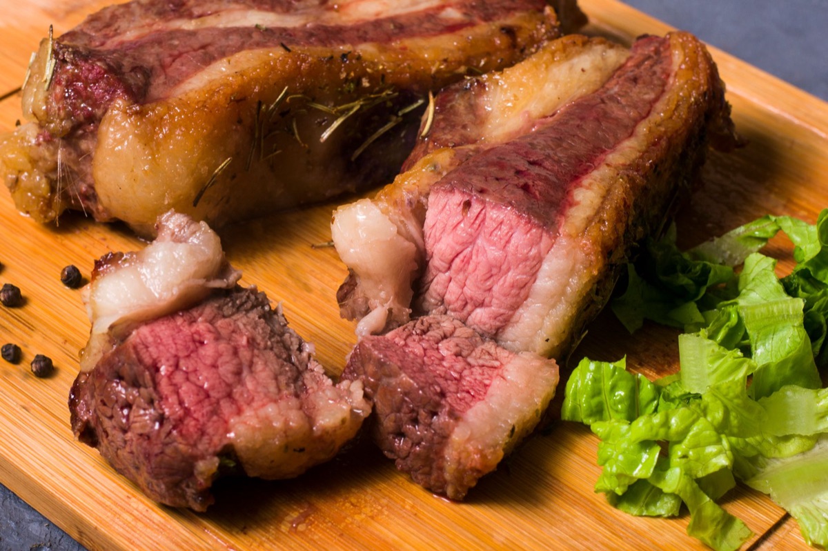 Sliced medium rare steak showing perfect pink center